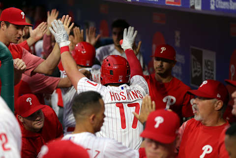 PHILADELPHIA, PA – JUNE 27: Rhys Hoskins #17 of the Philadelphia Phillies high-fives teammates in the dugout after hitting a three-run home run in the second inning during a game against the New York Yankees at Citizens Bank Park on June 27, 2018 in Philadelphia, Pennsylvania. The Phillies won 3-0. (Photo by Hunter Martin/Getty Images)