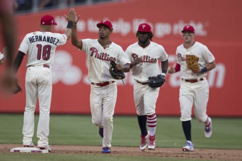 PHILADELPHIA, PA – JULY 4: Cesar Hernandez #16, Nick Williams #5, Odubel Herrera #37, and Rhys Hoskins #17 of the Philadelphia Phillies high five after the game against the Baltimore Orioles at Citizens Bank Park on July 4, 2018 in Philadelphia, Pennsylvania. The Phillies defeated the Orioles 4-1. (Photo by Mitchell Leff/Getty Images)