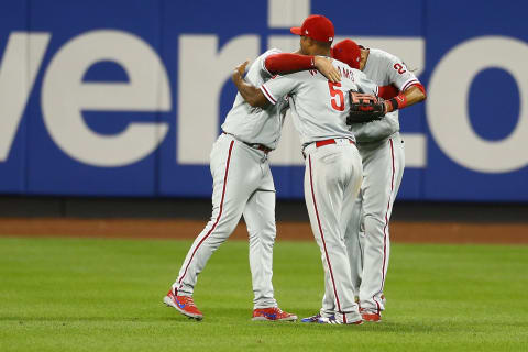 NEW YORK, NY – JULY 09: Nick Williams #5, Aaron Altherr #23 and Rhys Hoskins #17 of the Philadelphia Phillies celebrate after defeating the New York Mets 3-1 during game two of a doubleheader at Citi Field on July 9, 2018 in the Flushing neighborhood of the Queens borough of New York City. (Photo by Mike Stobe/Getty Images)