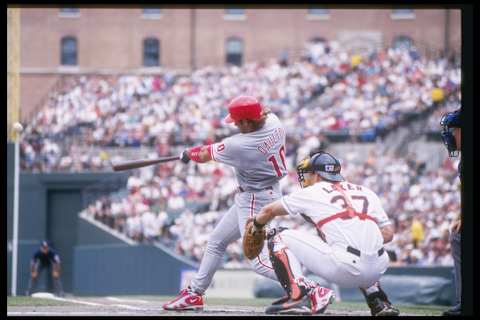 2 Jul 1997: Center Darren Daulton of the Philadelphia Phillies swings at the ball as catcher Tim Laker of the Baltimore Orioles watches during a game at Camden Yards in Baltimore, Maryland. The Orioles won the game 10-6.