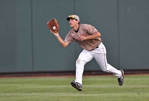 Omaha, NE – JUNE 22: Center fielder Adam Haseley #7 of the Virginia Cavaliers runs in to make a catch against the Vanderbilt Commodores in the fourth inning during game one of the College World Series Championship Series on June 22, 2015 at TD Ameritrade Park in Omaha, Nebraska. (Photo by Peter Aiken/Getty Images)