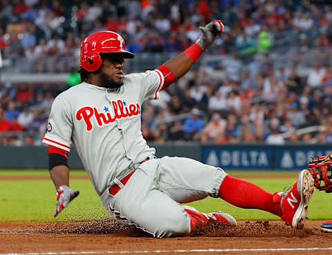 ATLANTA, GA – AUGUST 09: Odubel Herrera #37 of the Philadelphia Phillies slides safely into third base after hitting a triple and then scores on a throwing error by Ozzie Albies #1 of the Atlanta Braves in the third inning at SunTrust Park on August 9, 2017 in Atlanta, Georgia. (Photo by Kevin C. Cox/Getty Images)