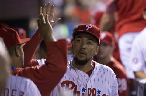 PHILADELPHIA, PA – SEPTEMBER 18: J.P. Crawford #2 of the Philadelphia Phillies hive fives his teammates in the dugout after throwing out Yasiel Puig #66 of the Los Angeles Dodgers (NOT PICTURED) in the top of the eighth inning at Citizens Bank Park on September 18, 2017 in Philadelphia, Pennsylvania. The Phillies defeated the Dodgers 4-3. (Photo by Mitchell Leff/Getty Images)