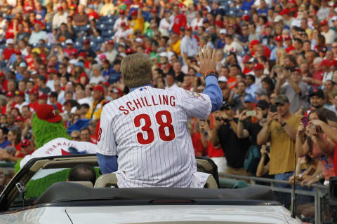 PHILADELPHIA – AUGUST 2: Former Philadelphia Phillie Curt Schilling waves to the fans after his induction ceremony into the Phillies ‘Wall of Fame’ before a game against the Atlanta Braves at Citizens Bank Park on August 2, 2013 in Philadelphia, Pennsylvania. The Braves won 6-4. (Photo by Hunter Martin/Getty Images)