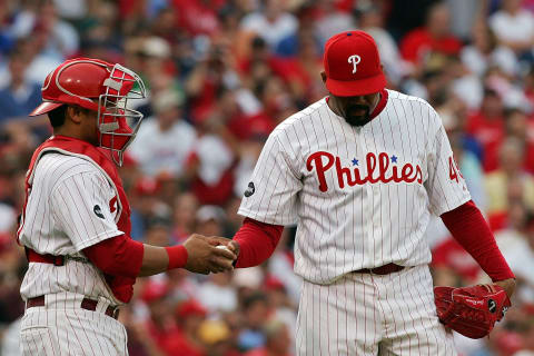 PHILADELPHIA – OCTOBER 04: Catcher Carlos Ruiz #51 hands the ball to pitcher Jose Mesa #49 of the Philadelphia Phillies while playing against the Colorado Rockies during Game Two of the National League Divisional Series at Citizens Bank Park on October 4, 2007 in Philadelphia, Pennsylvania. (Photo by Jim McIsaac/Getty Images)