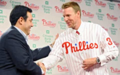 PHILADELPHIA – DECEMBER 16: Pitcher Roy Halladay (R) of the Philadelphia Phillies shakes hands with senior vice president and general manager Ruben Amaro, Jr. after signing with the the team on December 16, 2009 at Citizens Bank Park in Philadelphia, Pennsylvania. (Photo by Drew Hallowell/Getty Images)