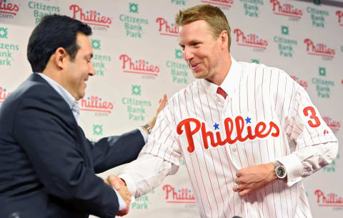 PHILADELPHIA – DECEMBER 16: Pitcher Roy Halladay (R) of the Philadelphia Phillies shakes hands with senior vice president and general manager Ruben Amaro, Jr. after signing with the the team on December 16, 2009 at Citizens Bank Park in Philadelphia, Pennsylvania. (Photo by Drew Hallowell/Getty Images)