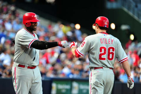 ATLANTA – SEPTEMBER 27: Chase Utley #26 of the Philadelphia Phillies is congratulated by Ryan Howard #6 after hitting a home run against the Atlanta Braves at Turner Field on September 27, 2011 in Atlanta, Georgia. (Photo by Scott Cunningham/Getty Images)