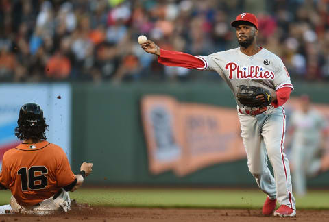 SAN FRANCISCO, CA – AUGUST 15: Jimmy Rollins #11 of the Philadelphia Phillies completes the double play over the top of Angel Pagan #16 of the San Francisco Giants in the bottom of the first inning at AT&T Park on August 15, 2014 in San Francisco, California. (Photo by Thearon W. Henderson/Getty Images)