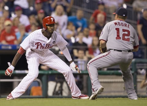 PHILADELPHIA, PA – JUNE 26: Tyler Moore #12 of the Washington Nationals tags out Domonic Brown #9 of the Philadelphia Phillies to end the game on June 26, 2015 at the Citizens Bank Park in Philadelphia, Pennsylvania. The Nationals defeated the Phillies 5-2. (Photo by Mitchell Leff/Getty Images)