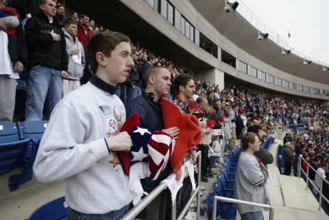 PHILADELPHIA – APRIL 4: Fans stand at attention during the national anthem before the home opener between the Philadelphia Phillies and the Pittsburgh Pirates at Veterans Stadium on April 4, 2003 in Philadelphia, Pennsylvania. The Pirates defeated the Phillies 9-1. (Photo by Al Bello/Getty Images)