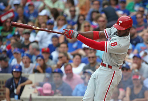 CHICAGO, IL – JULY 26: Domonic Brown #9 of the Philadelphia Phillies hits a two-run triple in the 5th inning against the Chicago Cubs at Wrigley Field on July 26, 2015 in Chicago, Illinois. (Photo by Jonathan Daniel/Getty Images)