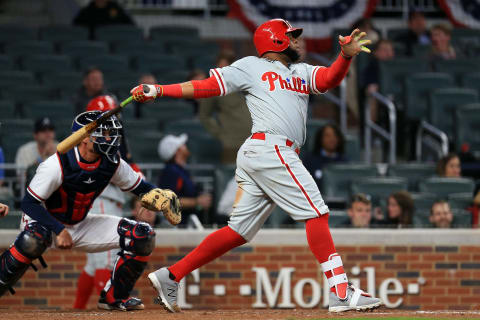 ATLANTA, GA – MARCH 30: Carlos Santana #41 of the Philadelphia Phillies hits an RBI sacrifice fly during the eleventh inning against the Atlanta Braves at SunTrust Park on March 30, 2018 in Atlanta, Georgia. (Photo by Daniel Shirey/Getty Images)