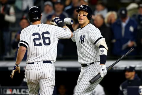 NEW YORK, NEW YORK – OCTOBER 18: DJ LeMahieu #26 of the New York Yankees celebrates with Aaron Judge #99 after hitting a solo home run against Justin Verlander #35 of the Houston Astros during the first inning in game five of the American League Championship Series at Yankee Stadium on October 18, 2019 in New York City. (Photo by Mike Stobe/Getty Images)