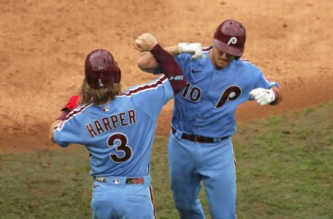 Bryce Harper #3 and J.T. Realmuto #10 of the Philadelphia Phillies (Photo by Hunter Martin/Getty Images)