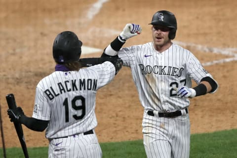 DENVER, COLORADO – JULY 31: Trevor Story #27 of the Colorado Rockies is congratulated by Charlie Blackmon #19 after hitting a solo home run in the seventh inning against the San Diego Padres at Coors Field on July 31, 2020 in Denver, Colorado. (Photo by Matthew Stockman/Getty Images)