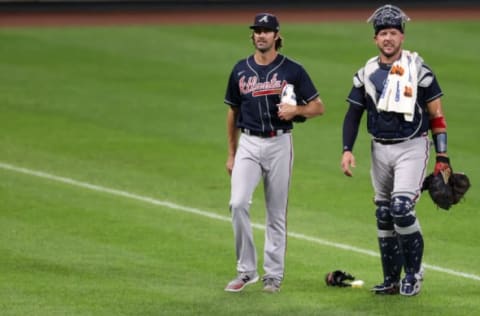 Starting pitcher Cole Hamels #32 and catcher Tyler Flowers #25 of the Atlanta Braves (Photo by Rob Carr/Getty Images)