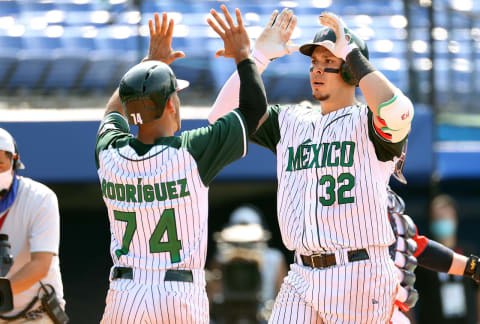 YOKOHAMA, JAPAN – JULY 31: Isaac Rodriguez #74 and Joey Meneses #32 of Team Mexico celebrate at home plate after Meneses hit a two-run home run against Team Japan in the eighth inning during the baseball opening round Group A game on day eight of the Tokyo 2020 Olympic Games at Yokohama Baseball Stadium on July 31, 2021 in Yokohama, Kanagawa, Japan. (Photo by Koji Watanabe/Getty Images)