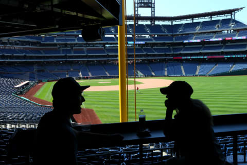 PHILADELPHIA, PA – SEPTEMBER 30: Two early arriving fans are silhouetted before a game between the Atlanta Braves and the Philadelphia Phillies at Citizens Bank Park on September 30, 2018 in Philadelphia, Pennsylvania. (Photo by Rich Schultz/Getty Images)