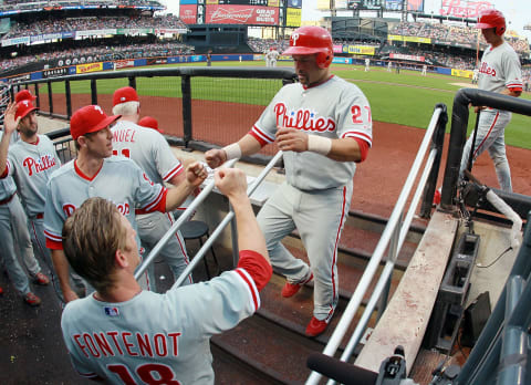 NEW YORK, NY – JULY 05: Placido Polanco #27 of the Philadelphia Phillies celebrates with his teammates after scoring a second inning run against the New York Mets at Citi Field on July 5, 2012 in the Flushing neighborhood of the Queens borough of New York City. (Photo by Jim McIsaac/Getty Images)