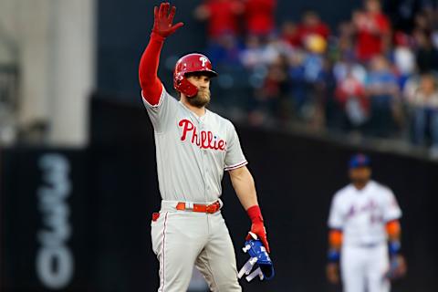 NEW YORK, NEW YORK – APRIL 24: Bryce Harper #3 of the Philadelphia Phillies reacts at second base after his first inning run scoring double against the New York Mets at Citi Field on April 24, 2019 in New York City. (Photo by Jim McIsaac/Getty Images)