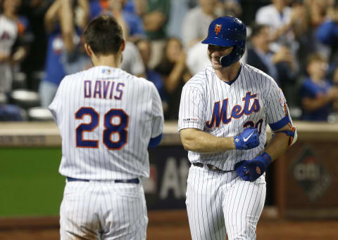 NEW YORK, NEW YORK – SEPTEMBER 28: Pete Alonso #20 of the New York Mets celebrates his third inning home run against the Atlanta Braves with teammate J.D. Davis #28 at Citi Field on September 28, 2019 in New York City. The Mets defeated the Braves 3-0. The home run was Alonso’s 53rd of the season setting a new rookie record.(Photo by Jim McIsaac/Getty Images)