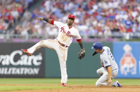 PHILADELPHIA, PA - AUGUST 10: Jean Segura #2 of the Philadelphia Phillies attempts to turn a double play against Corey Seager #5 of the Los Angeles Dodgers at Citizens Bank Park on August 10, 2021 in Philadelphia, Pennsylvania. The Dodgers defeated the Phillies 5-0. (Photo by Mitchell Leff/Getty Images)