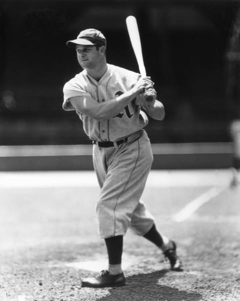 circa 1930: Full-length portrait of American baseball player Jimmie Foxx (1907 – 1967), first-baseman and slugger for the Philadelphia Athletics, wearing his uniform and holding the follow-through of his swing while standing at home plate. (Photo by Photo File/Getty Images)