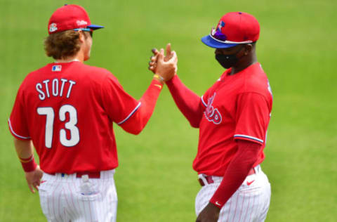 Bryson Stott #73 and Didi Gregorius #18 of the Philadelphia Phillies (Photo by Julio Aguilar/Getty Images)