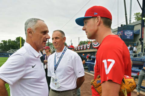 PHILADELPHIA, PA - AUGUST 19: Major League Baseball Commissioner Rob Manfred talks with Rhys Hoskins #17 of the Philadelphia Phillies before the game against the New York Mets at BB&T Ballpark on August 19, 2018 in Williamsport, Pennsylvania. (Photo by Drew Hallowell/Getty Images)