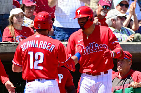 CLEARWATER, FLORIDA - MARCH 28: Kyle Schwarber #12 and Nick Castellanos #8 of the Philadelphia Phillies celebrate after Schwarber hit a home run in the third inning against the Baltimore Orioles during a Grapefruit League spring training game at BayCare Ballpark on March 28, 2022 in Clearwater, Florida. (Photo by Julio Aguilar/Getty Images)