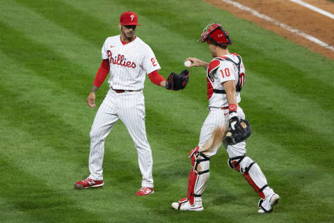 Philadelphia Phillies catcher J.T. Realmuto (10) hands a ball to starting pitcher Vince Velasquez (21) (Bill Streicher/USA TODAY Sports)