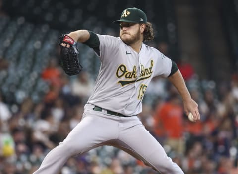 Oct 3, 2021; Houston, Texas, USA; Oakland Athletics starting pitcher Cole Irvin (19) delivers a pitch during the first inning against the Houston Astros at Minute Maid Park. Mandatory Credit: Troy Taormina-USA TODAY Sports