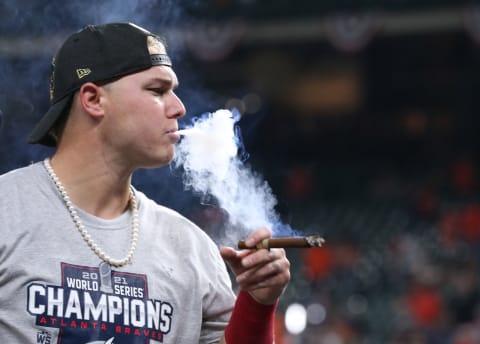 Joc Pederson smokes a cigar after defeating the Houston Astros in game six of the 2021 World Series at Minute Maid Park. Mandatory Credit: Troy Taormina-USA TODAY Sports