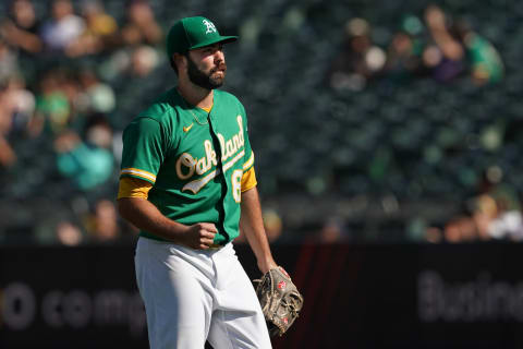 Sep 12, 2021; Oakland, California, USA; Oakland Athletics relief pitcher Lou Trivino (62) reacts after the final out of the top of the ninth inning against the Texas Rangers at RingCentral Coliseum. Mandatory Credit: Darren Yamashita-USA TODAY Sports