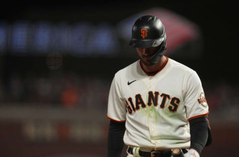 Oct 9, 2021; San Francisco, California, USA; San Francisco Giants center fielder Kris Bryant (23) reacts after taking a called third strike against the Los Angeles Dodgers in the eighth inning during game two of the 2021 NLDS at Oracle Park. Mandatory Credit: Neville E. Guard-USA TODAY Sports