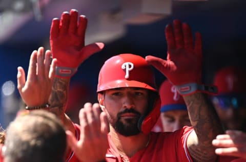 Mar 27, 2022; Dunedin, Florida, USA; Philadelphia Phillies left fielder Nick Castellanos (8) celebrates with his teammates after scoring as run in the third inning of the game against the Toronto Blue Jays during spring training at TD Ballpark. Mandatory Credit: Jonathan Dyer-USA TODAY Sports