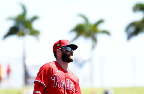 Mar 22, 2022; Clearwater, Florida, USA; Philadelphia Phillies right fielder Bryce Harper (3) warms up before the start of the game against the Detroit Tigers during spring training at BayCare Ballpark. Mandatory Credit: Jonathan Dyer-USA TODAY Sports