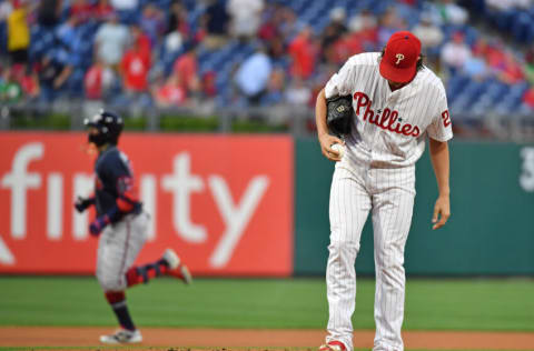 Sep 9, 2019; Philadelphia, PA, USA; Philadelphia Phillies starting pitcher Aaron Nola (27) reacts after allowing a home run to Atlanta Braves center fielder Ronald Acuna Jr. (13) during the first inning at Citizens Bank Park. Mandatory Credit: Eric Hartline-USA TODAY Sports