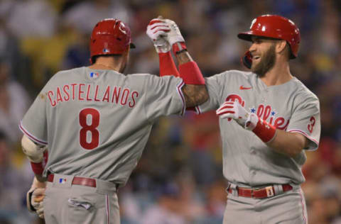 May 13, 2022; Los Angeles, California, USA; Philadelphia Phillies right fielder Bryce Harper (3) celebrates with left fielder Nick Castellanos (8) after hitting a solo home run in the eighth inning against the Los Angeles Dodgers at Dodger Stadium. Mandatory Credit: Jayne Kamin-Oncea-USA TODAY Sports