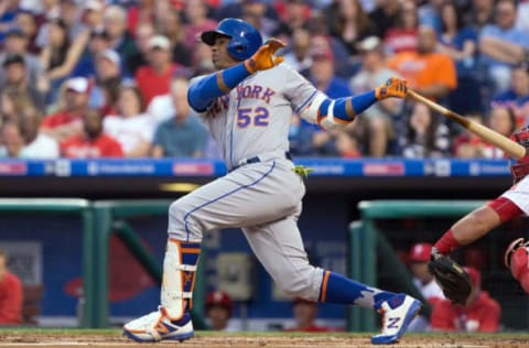 Apr 11, 2017; Philadelphia, PA, USA; New York Mets left fielder Yoenis Cespedes (52) hits a three RBI home run against the Philadelphia Phillies during the first inning at Citizens Bank Park. Mandatory Credit: Bill Streicher-USA TODAY Sports