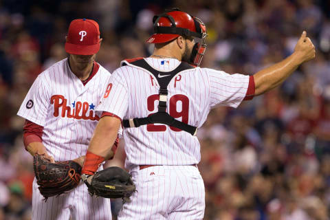 Apr 11, 2017; Philadelphia, PA, USA; Philadelphia Phillies catcher Cameron Rupp (29) signals for the trainer after starting pitcher Clay Buchholz (21) is injured during the third inning against the New York Mets at Citizens Bank Park. Mandatory Credit: Bill Streicher-USA TODAY Sports