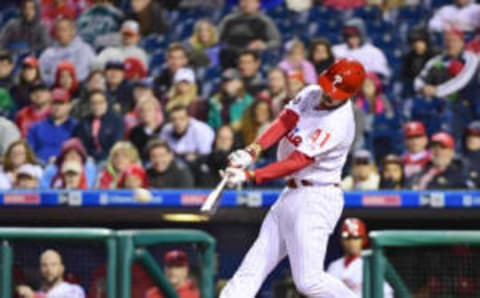 Apr 22, 2017; Philadelphia, PA, USA; Philadelphia Phillies first baseman Brock Stassi (41) hits a single during the tenth inning against the Atlanta Braves at Citizens Bank Park. The Phillies defeated the Braves, 4-3 in 10 innings. Mandatory Credit: Eric Hartline-USA TODAY Sports