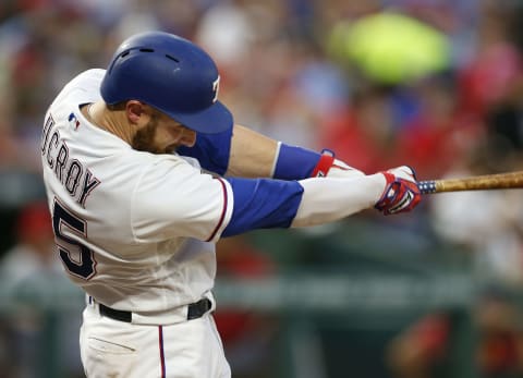 Apr 28, 2017; Arlington, TX, USA; Texas Rangers catcher Jonathan Lucroy (25) follows through on his single against the Los Angeles Angels during a baseball game at Globe Life Park in Arlington. Mandatory Credit: Jim Cowsert-USA TODAY Sports