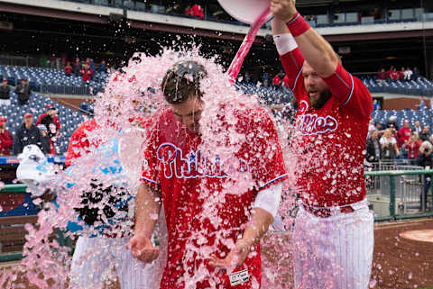 May 25, 2017; Philadelphia, PA, USA; Philadelphia Phillies first baseman Tommy Joseph (19) has ice dumped on him by catcher Cameron Rupp (29) and third baseman Andres Blanco (4) after hitting a walk off RBI single during the eleventh inning against the Colorado Rockies at Citizens Bank Park. Mandatory Credit: Bill Streicher-USA TODAY Sports