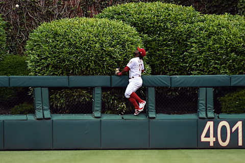 May 26, 2017; Philadelphia, PA, USA; Philadelphia Phillies center fielder Odubel Herrera (37) leaps and watches as a home run ball hit by Cincinnati Reds right fielder Scott Schebler (not shown) during the second inning of the game at Citizens Bank Park. Mandatory Credit: John Geliebter-USA TODAY Sports