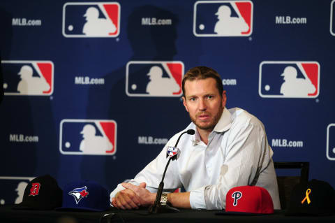 Dec 9, 2013; Orlando, FL, USA; Roy Halladay announces his retirement at the MLB Winter Meetings at Walt Disney World Swan and Dolphin Resort. Halladay signed a one-day contract and retired with the Toronto Blue Jays. Mandatory Credit: David Manning-USA TODAY Sports