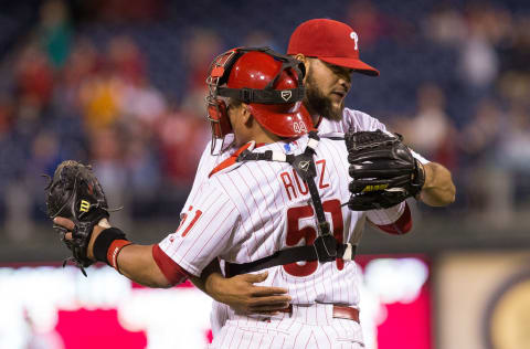 May 15, 2015; Philadelphia, PA, USA; Philadelphia Phillies relief pitcher Luis Garcia (57) and catcher Carlos Ruiz (51) celebrate a victory against the Arizona Diamondbacks at Citizens Bank Park. The Phillies won 4-3. Mandatory Credit: Bill Streicher-USA TODAY Sports