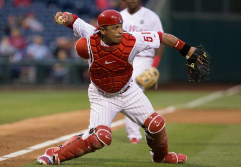 Jun 4, 2015; Philadelphia, PA, USA; Philadelphia Phillies catcher Carlos Ruiz (51) throws out Cincinnati Reds center fielder Billy Hamilton (not pictured) on a sacrifice bunt during the fifth inning at Citizens Bank Park. Mandatory Credit: Bill Streicher-USA TODAY Sports