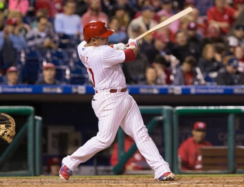 Jun 4, 2015; Philadelphia, PA, USA; Philadelphia Phillies catcher Carlos Ruiz (51) breaks his bat as he hits a single against the Cincinnati Reds during the eighth inning at Citizens Bank Park. The Reds won 6-4. Mandatory Credit: Bill Streicher-USA TODAY Sports